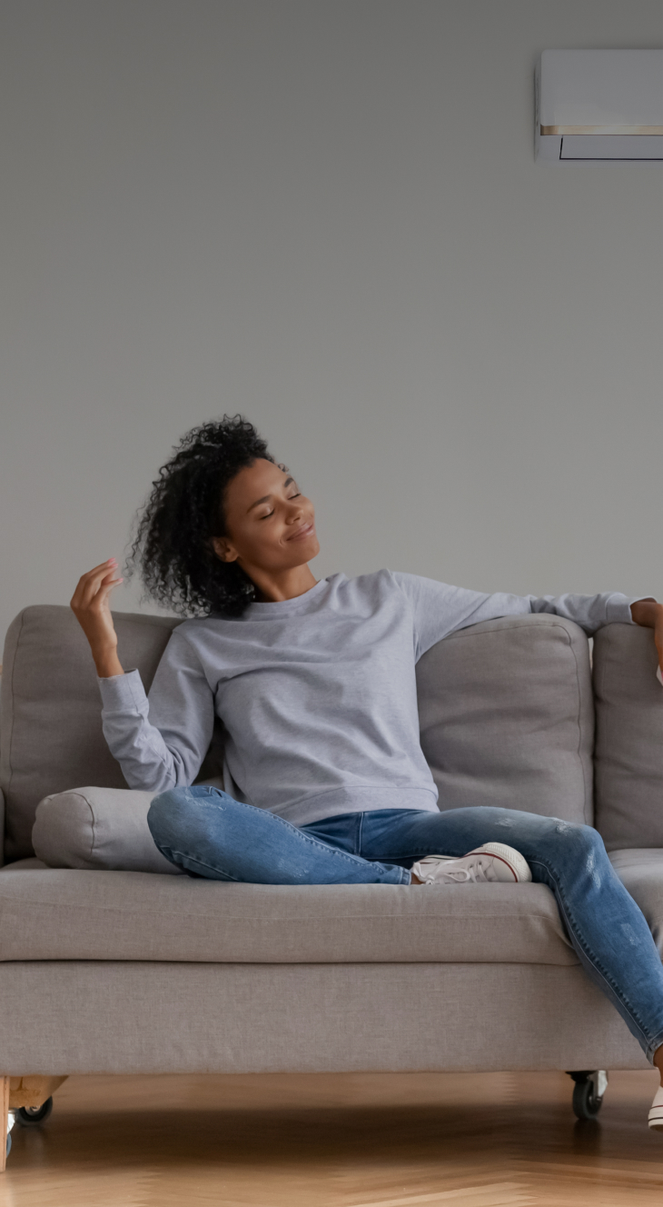 Woman sitting on couch smiling